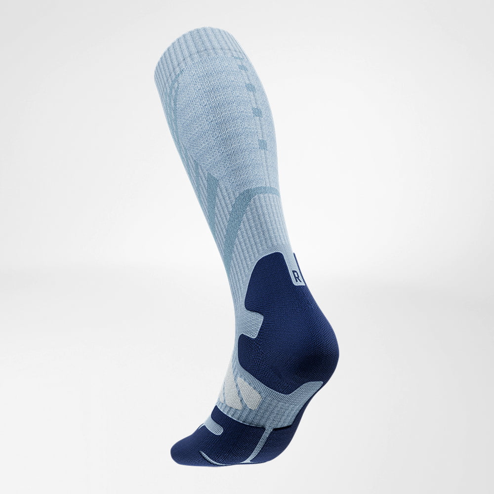 Lateral back view of the merino hiking socks in light blue