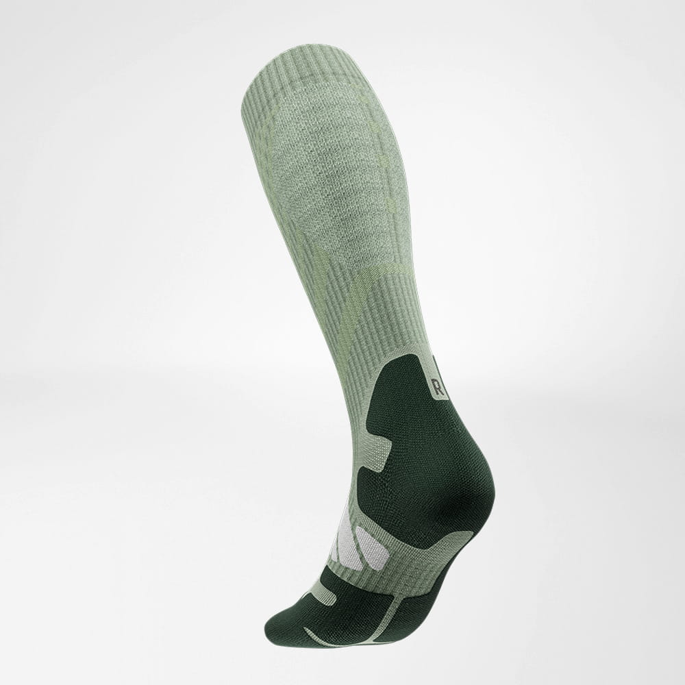 Lateral back view of the merino hiking socks in light green