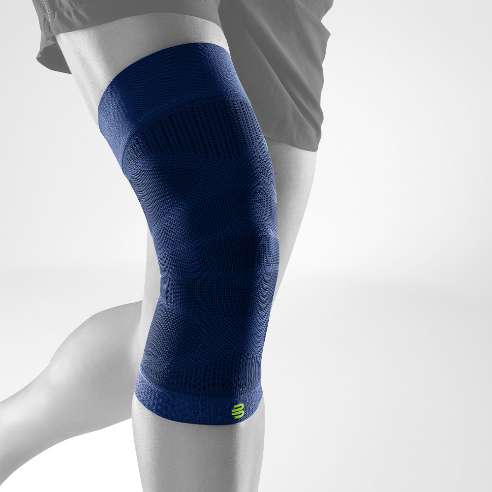 Complete view of the dark blue Knee Sleeves on a stylized gray leg
