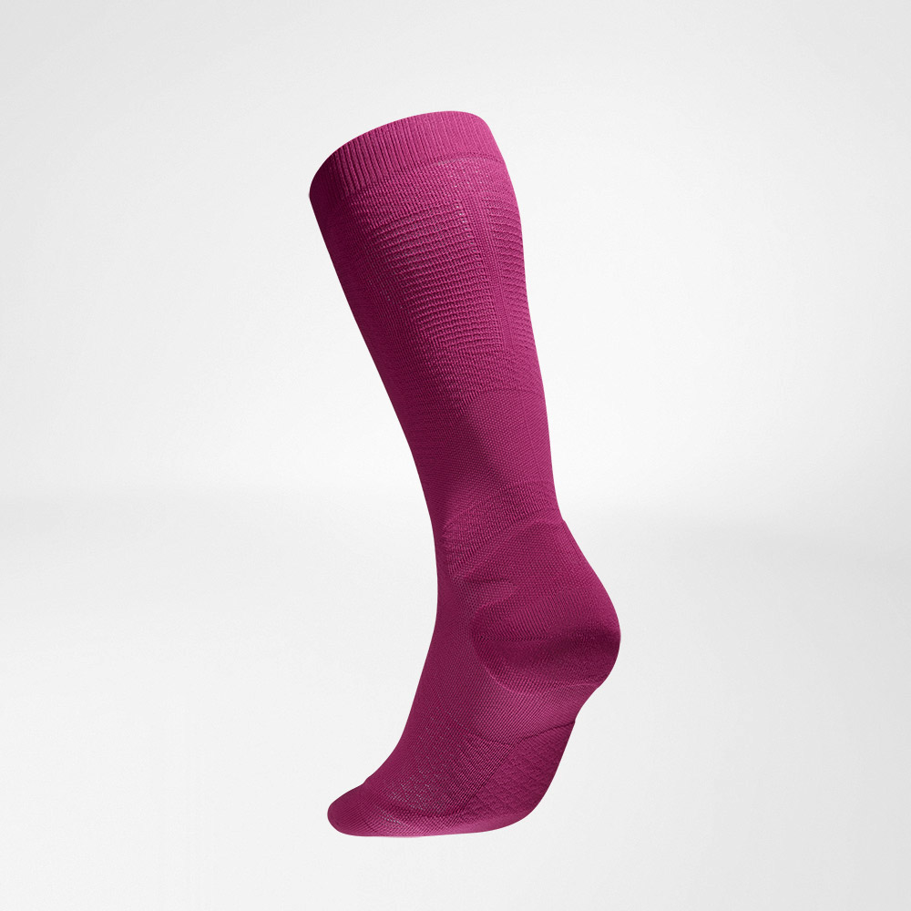 Lateral back view of the pink -colored airy knitted compression socks and running