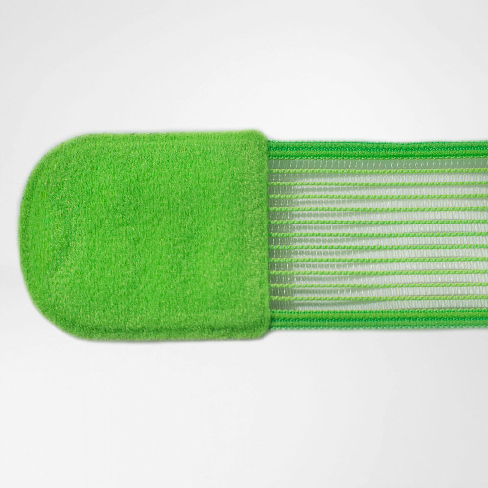 Detailed view of the green taping belonging to the ankle bandage with a focus on the closure element