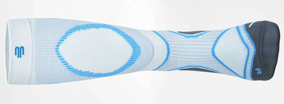 Front complete view of the white -blue compression stockings to run - lying on the side