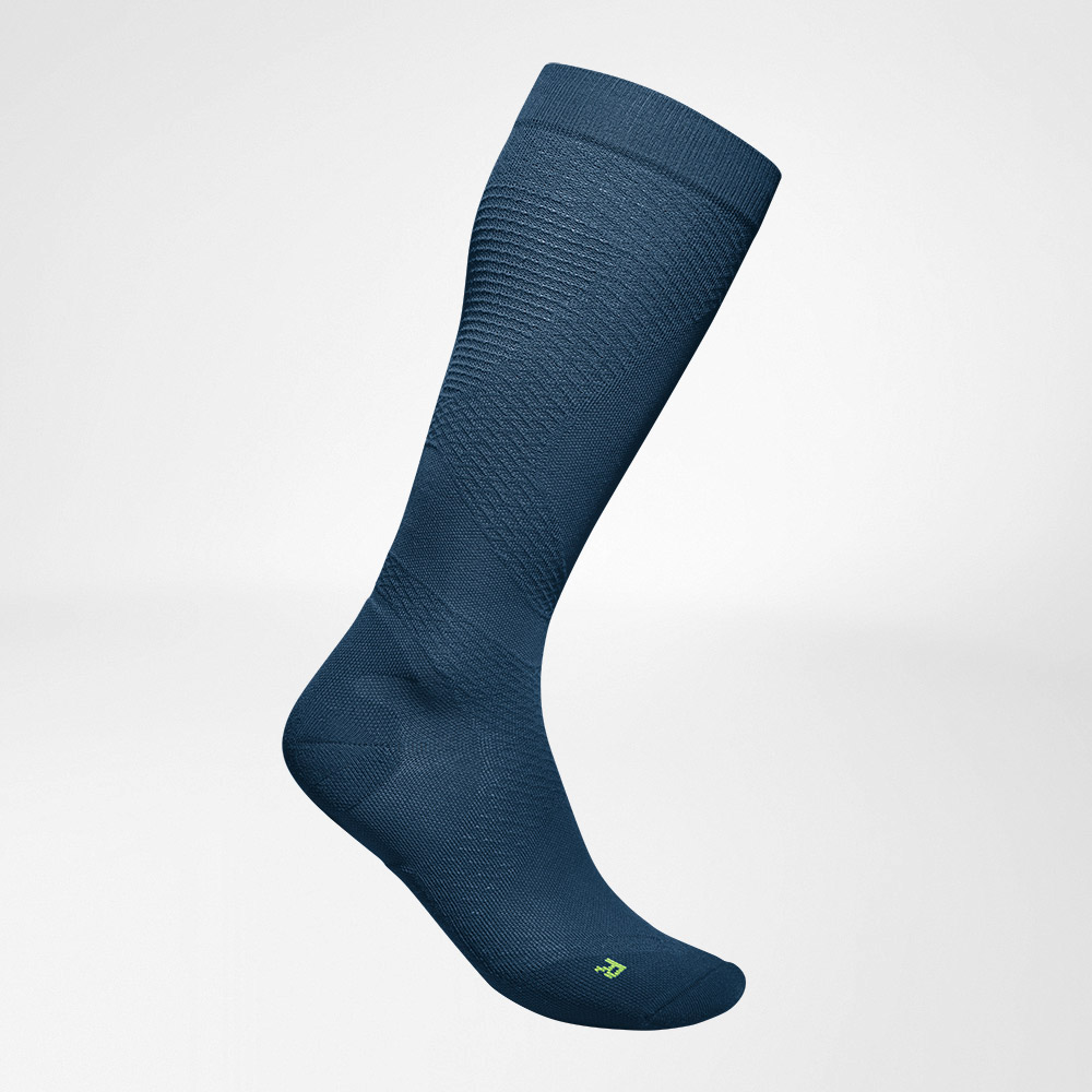 Lateral complete view of the blue airy, knitted compression socks to run