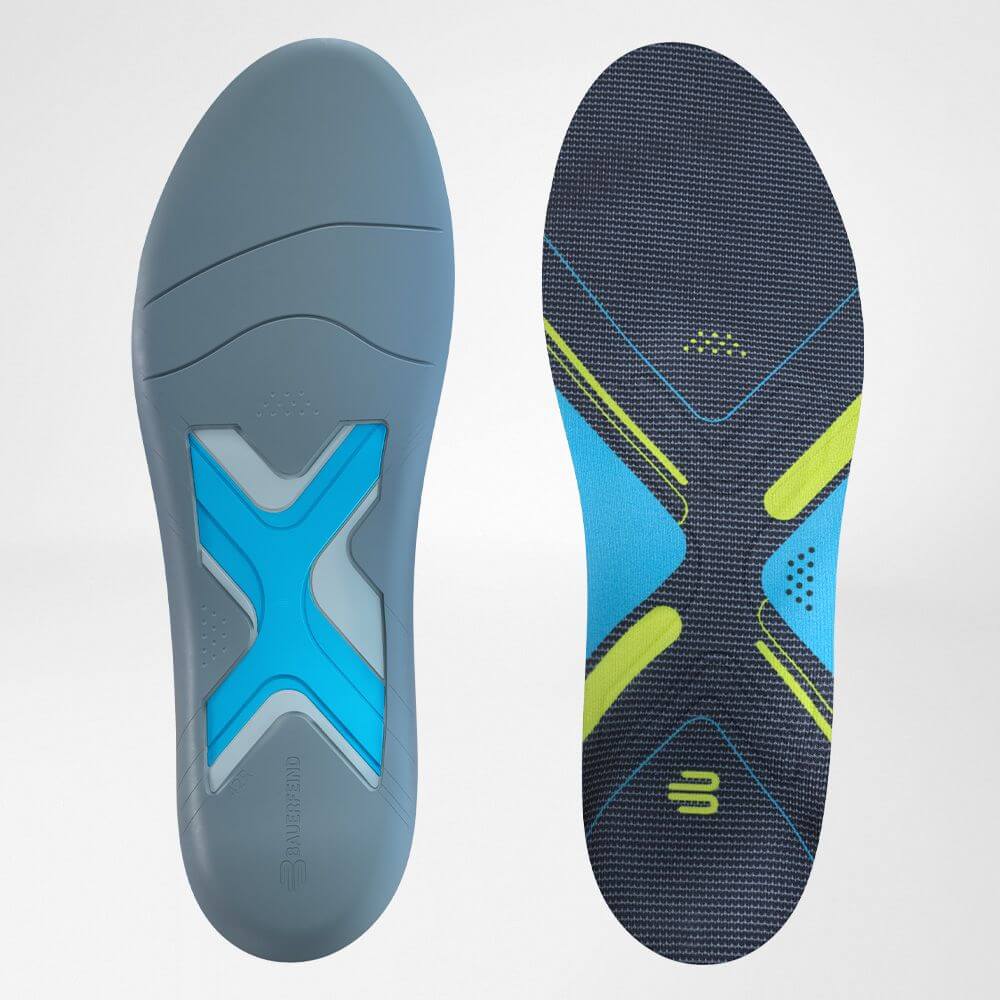 Two insoles lying next to each other for running shoes one in the front and rear view