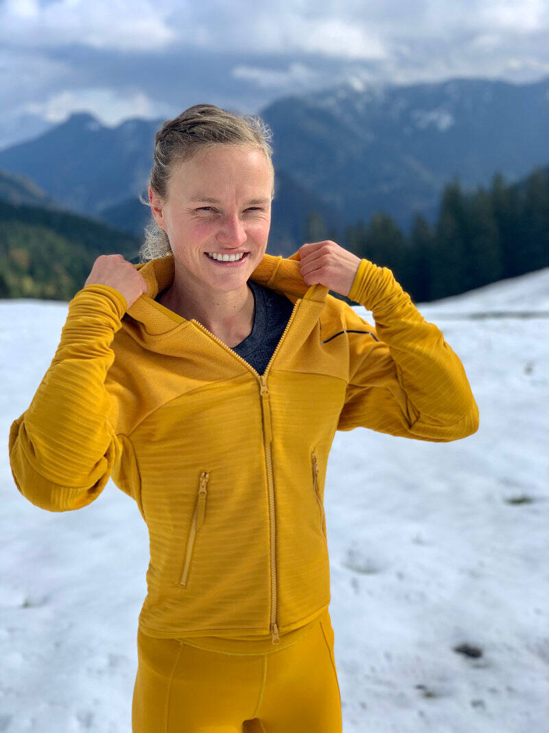 Anna Hahner in a yellow suit in winter landscape