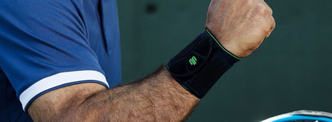 Arm of a tennis player with wrist bandage