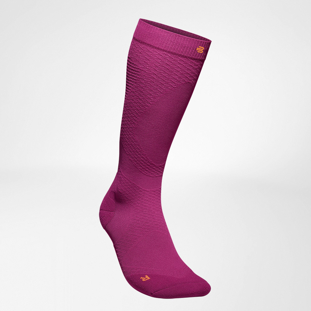Lateral front view of the pink -colored airy knitted compression socks to run